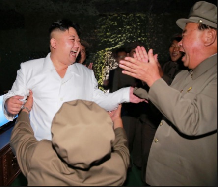 Kim Jong-un dances with soldiers as he celebrates a North Korean missile test. Everybody is happy.