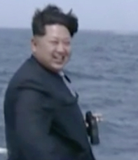 Kim Jong-un watching submarine's test missile launch.