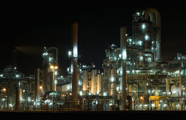 An industrial plant lit up at night