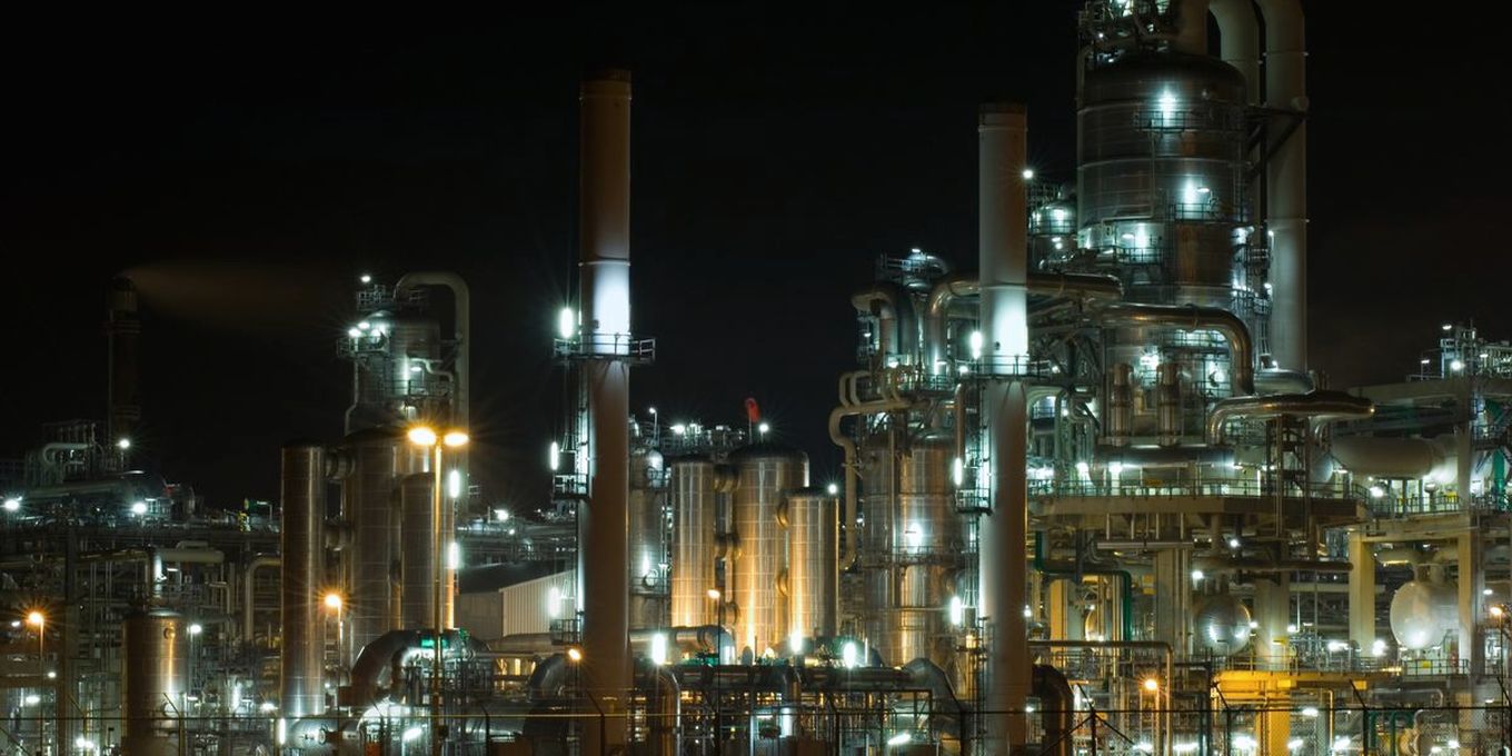 An industrial plant lit up at night